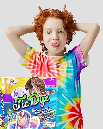 Tie-dye kit packaging featuring colorful designs, showcasing 5 colors and claiming to create cool patterns. A vibrant tie-dye shirt is visible in the background.