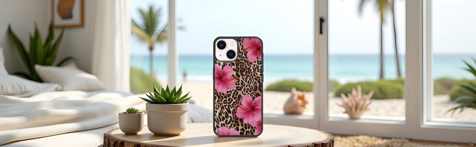 A vibrant floral arrangement with pink hibiscus flowers and leopard print accents on a sleek surface