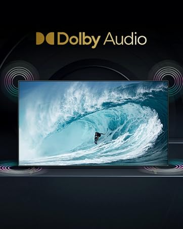a person surfing on a wave in front of a screen.