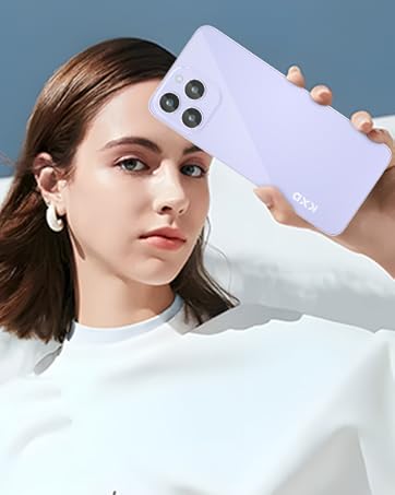 White smartphone with triple camera setup being held up by a hand against a blue background.