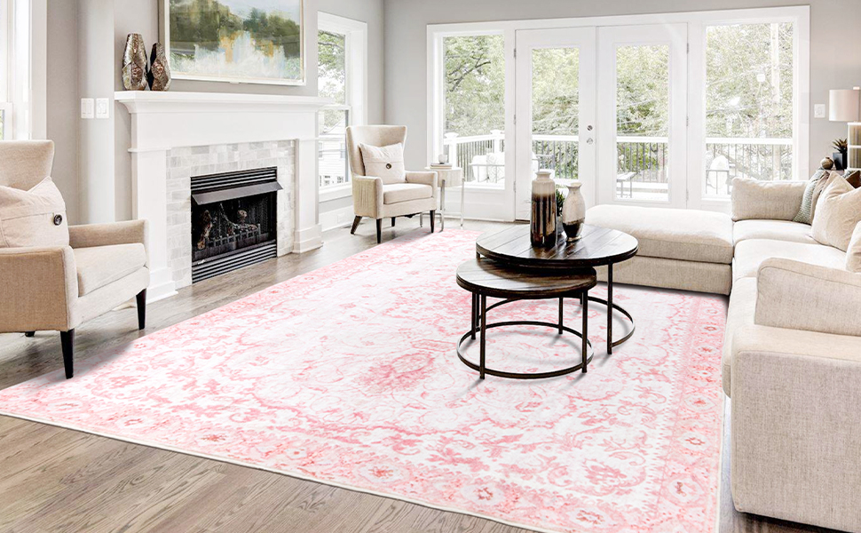 pink area rug beside fireplace