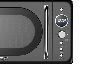 Black retro-style microwave oven with rounded edges. Features a digital clock display showing 12:05, chrome handle, and multiple control buttons on the right side panel.