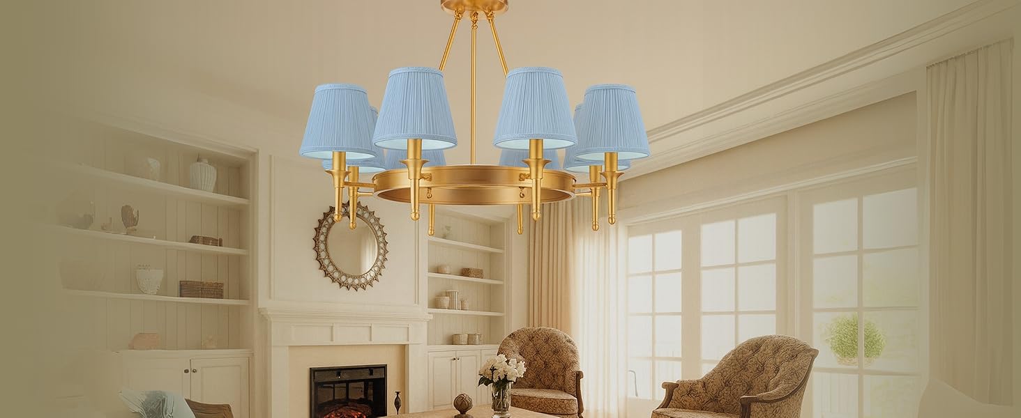 A living room with a 6-light chandelier and fabric shades.