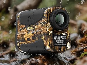Camouflage-patterned rangefinder with black accents, featuring a digital display and lens. Shown in rainy outdoor setting, suggesting water-resistant design.