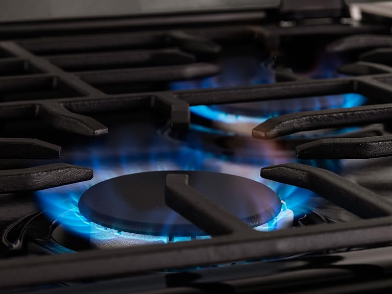 Stove burners with flames on.