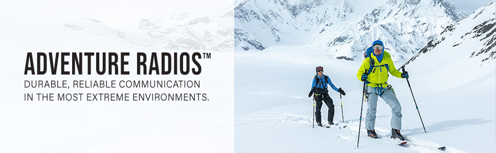 Two people skiing in the mountains with Rocky Talkie radios