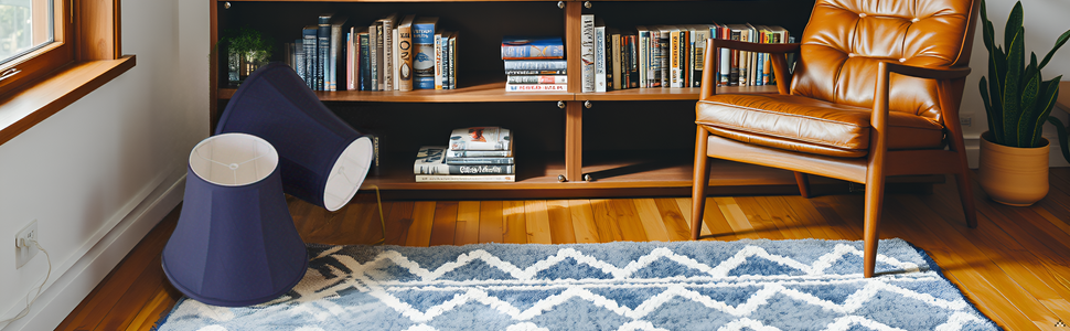 A cozy living room with a product on a side table, surrounded by books and a warm fireplace.